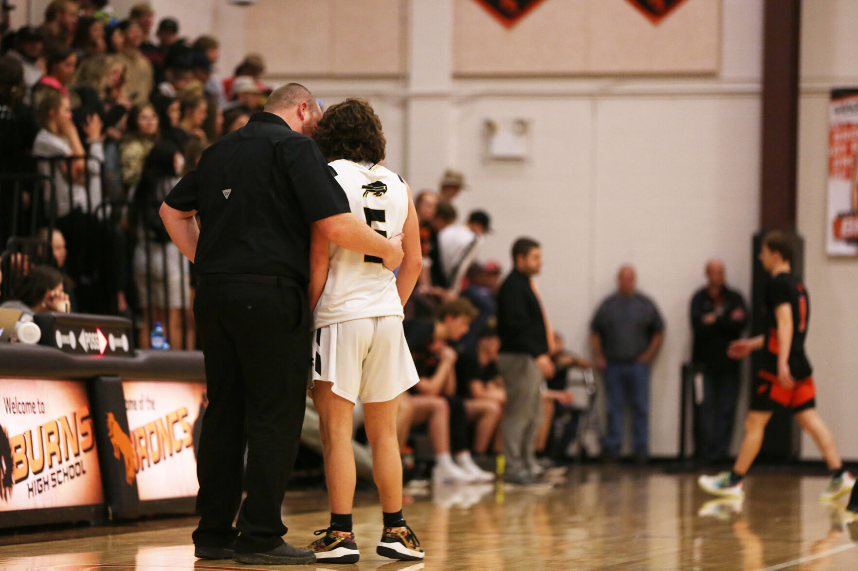 Tanner Hart talks with senior Tony Peters